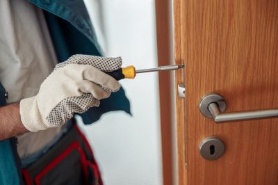 Handyman Repairing a Door